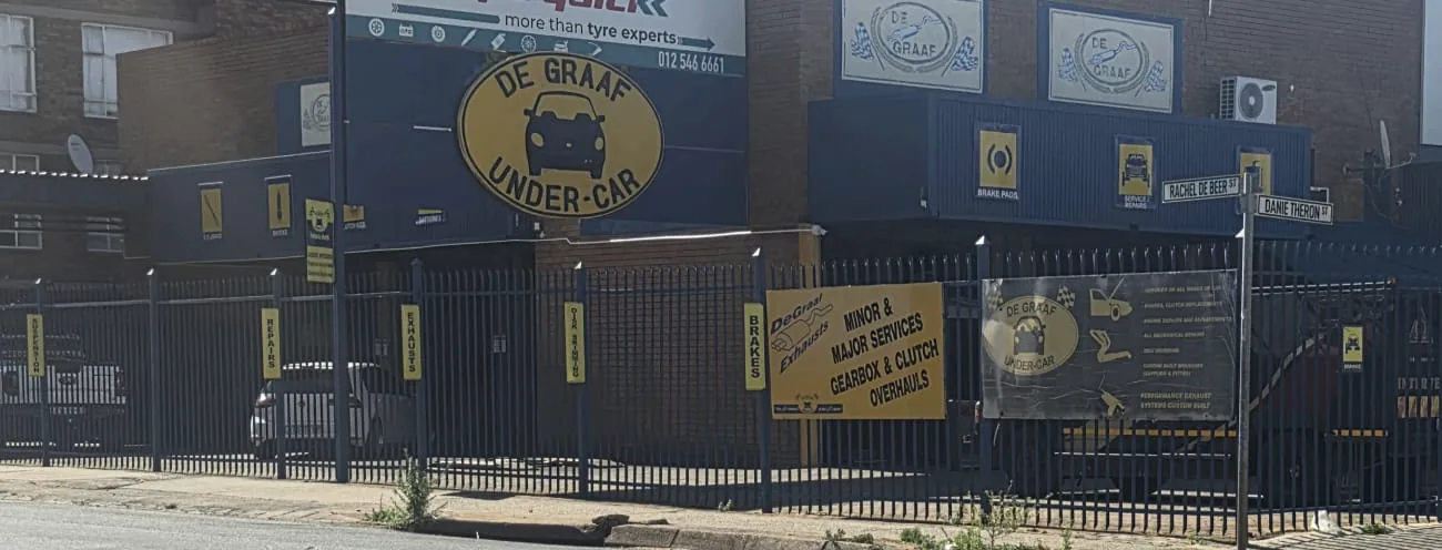 The De Graaf Under-Car workshop on Danie Theron Street with its yellow oval sign