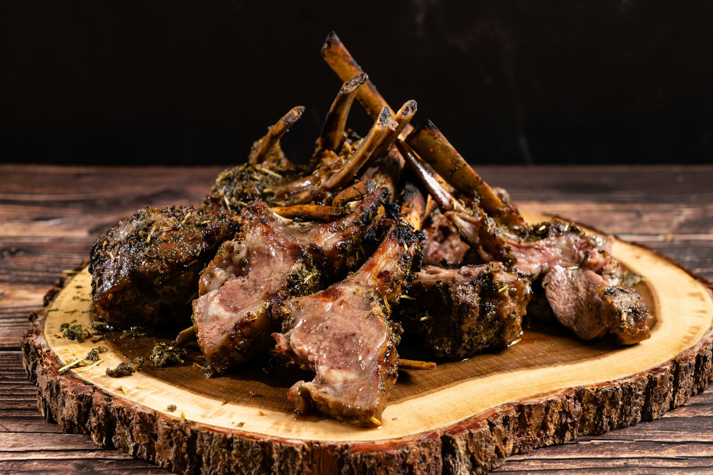 Grilled lamb rib chops on a wooden board