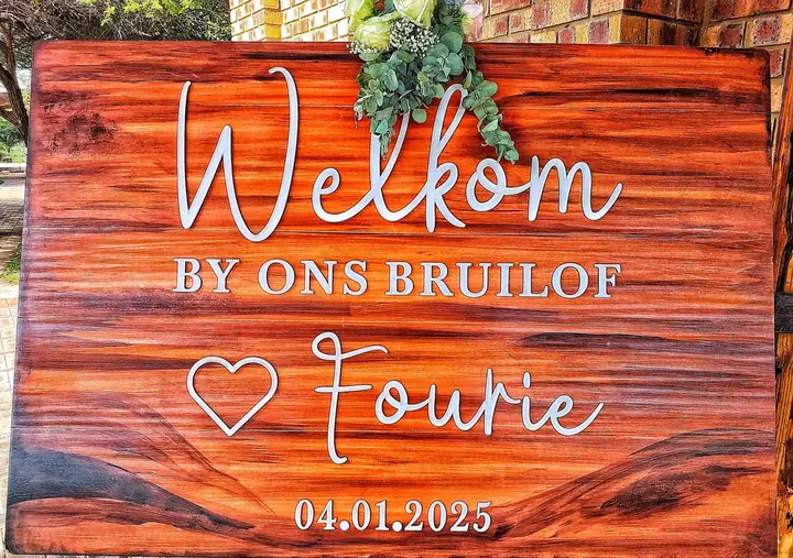 A wooden wedding welcome sign
