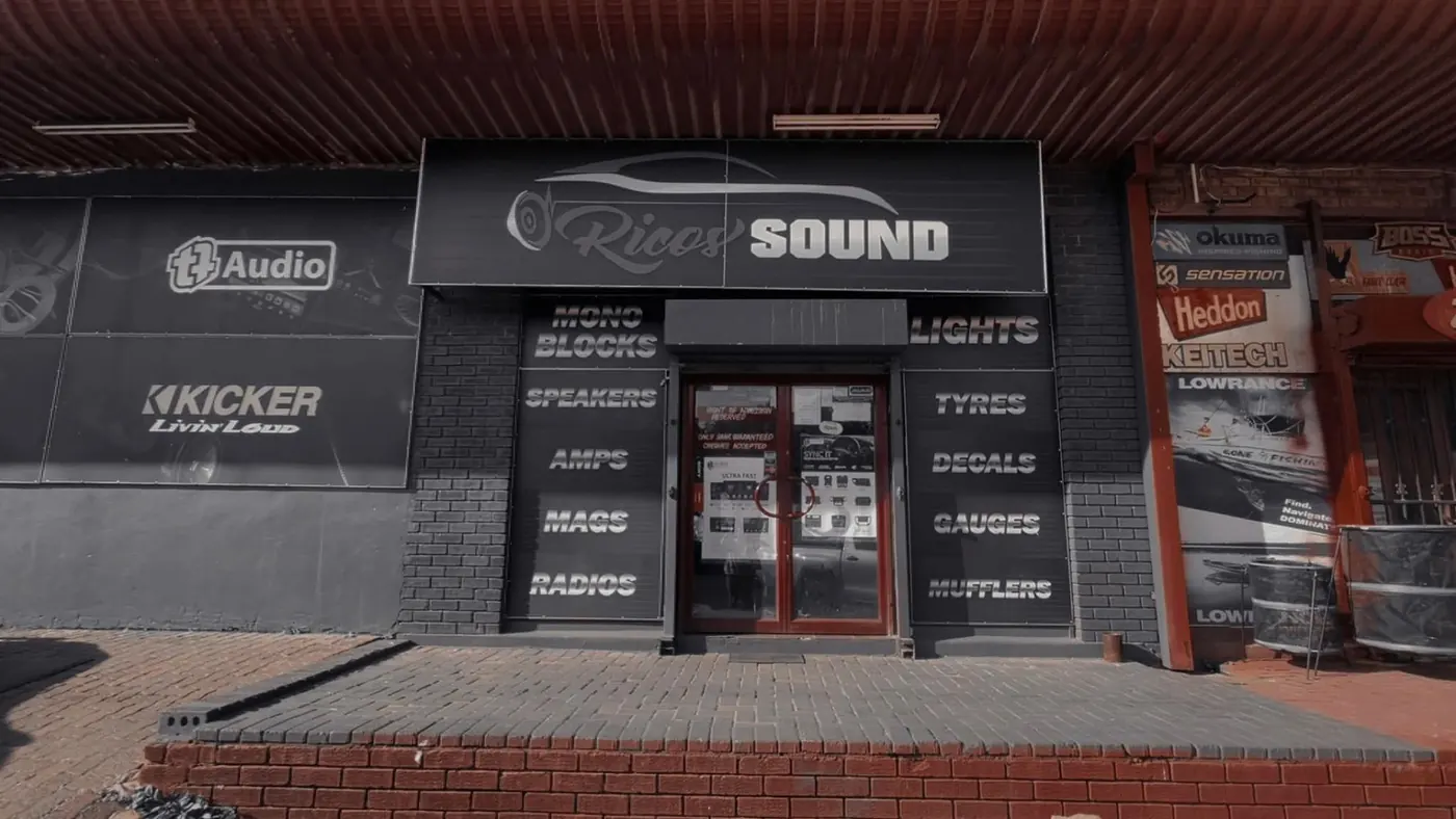The Rico's Sound shop front with its speakers, amps, mags, radios, lights, tyres, decals, gauges and mufflers signs